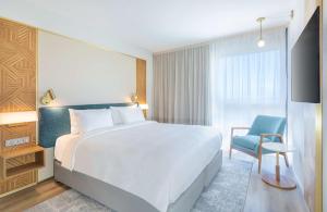 Voodi või voodid majutusasutuse Radisson Hotel Saint Denis, La Reunion toas
