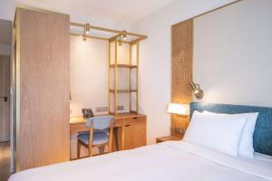 Voodi või voodid majutusasutuse Radisson Hotel Saint Denis, La Reunion toas