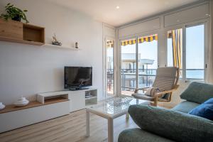 Χώρος καθιστικού στο AT036 Vista playa, piscina, primera línea