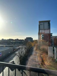 a view of a city from a balcony of a building at BEST PRICE! - HUGE 3 Bed 2 Bath City Centre Newly Refurbished Apartment, Up to 7 guests - FREE SECURE PARKING - SMART TV - SINGLES OR KING SIZE BEDS in Southampton