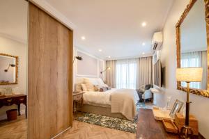 a bedroom with a bed and a large window at The Weinberg Urban Pod in Windhoek