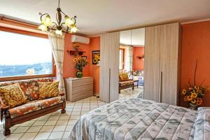 a bedroom with a bed and a couch at Casa Nicolò in Massa Lubrense +53 photos