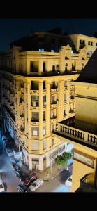 a large building with cars parked in front of it at Formidable of Cairo in Cairo