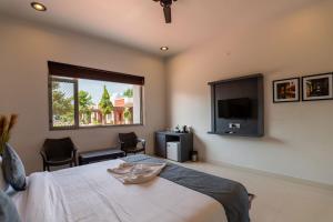 Postel nebo postele na pokoji v ubytování Vesta Avtar Resort Pushkar + 37 fotografií