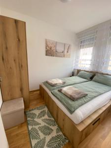 Postel nebo postele na pokoji v ubytování Angel Apartment