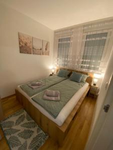 Postel nebo postele na pokoji v ubytování Angel Apartment
