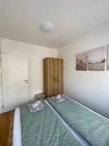 Postel nebo postele na pokoji v ubytování Angel Apartment