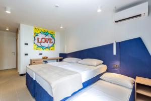 Postel nebo postele na pokoji v ubytování Hotel Ad Turres