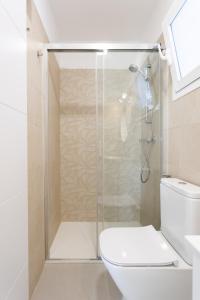 a bathroom with a shower and a toilet at Home2Book Stylish Studio Ocean View Tabaiba in Tabaiba