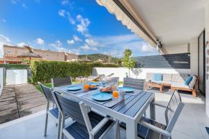a table and chairs on the patio of a house at Js Villas rental Ap La Perla 5 Puerto Pollensa in Port de Pollensa