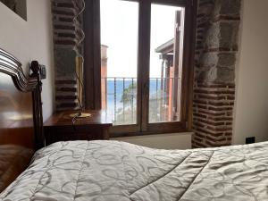 Postel nebo postele na pokoji v ubytování Albergo Diffuso Locanda Specchio Di Diana