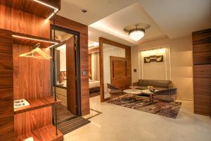 A seating area at Rj Hotel - Managed by Atithi House