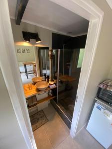 a view of a kitchen with a counter with sinks at Amapola Tiny House in San Carlos de Bariloche