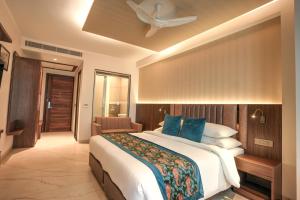 A bed or beds in a room at Rj Hotel - Managed by Atithi House