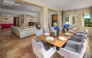 a dining room with a table and chairs at Beautiful Home In Valtura With House A Panoramic View in Valtura