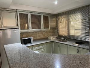A kitchen or kitchenette at Rentrific