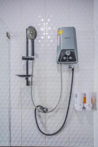 a shower with a blow dryer on a wall at Villa loved beach AO Nam Mao krabi in Ao Nam Mao +46 photos