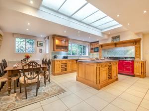 a kitchen with a table and a dining room at Ridge Hill Manor in Turners Hill