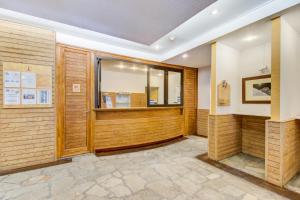 a room with wood paneling and a window at Vacancéole - Le Borsat IV in Tignes