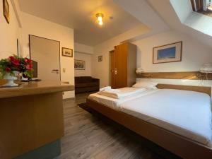 Postel nebo postele na pokoji v ubytování Krügers Hotel