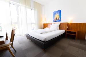 Postel nebo postele na pokoji v ubytování Hotel Darstein