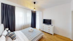Postel nebo postele na pokoji v ubytování Apartament de Lux Sibiu VRT