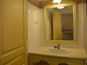 a bathroom with a sink and a mirror at Appartement 6 couchages avec piscine et parking aux Issambres - FR-1-226-386 in Les Issambres +5 photos