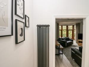 a living room with a radiator on the wall at Eden on the Crescent in Morecambe