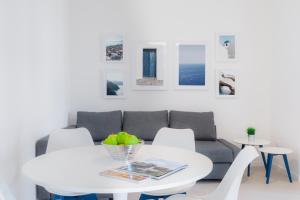 a living room with a couch and a table at Puolo Seaside Apartment 2 in Massa Lubrense