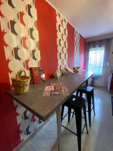a dining room with a table and chairs at CHEZ NOUS BIS in Commercy
