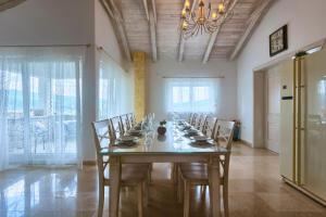 a large dining room with a long table and chairs at Villa Lapis with Private Pool in Buzet +36 photos