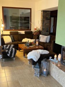 a living room with couches and a coffee table at Wellness Villa Liptov in Žiar