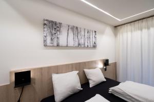 A bed or beds in a room at Gîte DDS