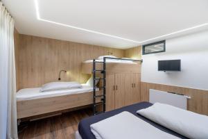A bed or beds in a room at Gîte DDS