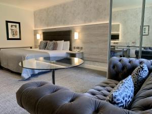 Voodi või voodid majutusasutuse Mill Park Hotel toas