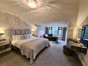 Voodi või voodid majutusasutuse Mill Park Hotel toas