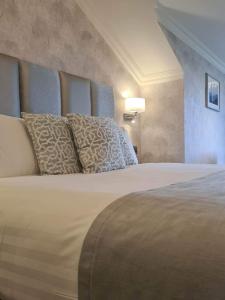 Voodi või voodid majutusasutuse Mill Park Hotel toas