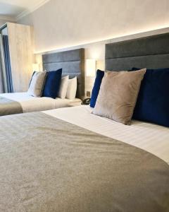 Voodi või voodid majutusasutuse Mill Park Hotel toas