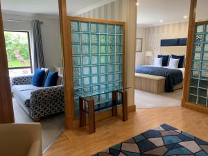 Voodi või voodid majutusasutuse Mill Park Hotel toas