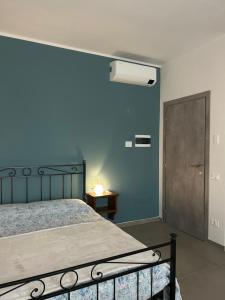 Ένα ή περισσότερα κρεβάτια σε δωμάτιο στο L'INCANTO CASA VACANZE