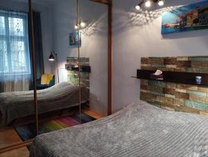 Posteľ alebo postele v izbe v ubytovaní Family Stay in Lviv (2 Rooms + Kitchen)