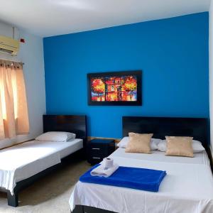Postel nebo postele na pokoji v ubytování HOTEL LUZ MERY