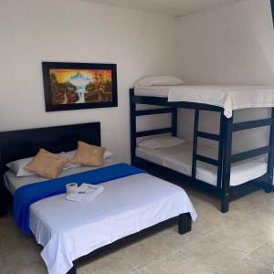 Postel nebo postele na pokoji v ubytování HOTEL LUZ MERY