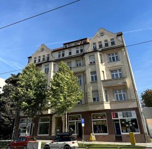 a building with a car parked in front of it at Victoria Apartment in Chemnitz