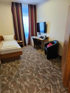 Postel nebo postele na pokoji v ubytování Best Western Hotel Dreiländerbrücke Weil am Rhein / Basel