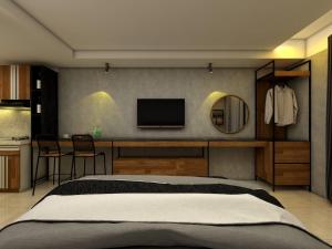 Postel nebo postele na pokoji v ubytování The yudhistira apartment