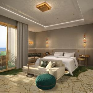 een slaapkamer met een groot bed en een bank bij Four Seasons Hotel Rabat at Kasr Al Bahr in Rabat