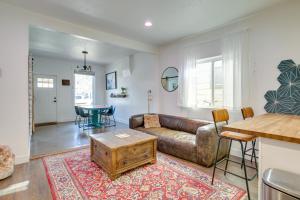 a living room with a couch and a table at Cozy and Pet-Friendly Home - 3 Mi to Downtown Denver in Denver