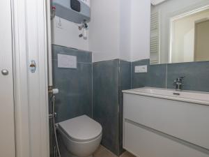 a bathroom with a toilet and a sink and a mirror at Appartement Menton, 2 pièces, 4 personnes - FR-1-196-340 in Menton