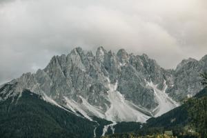 a large mountain range with snow on it at Naturhotel Leitlhof in San Candido